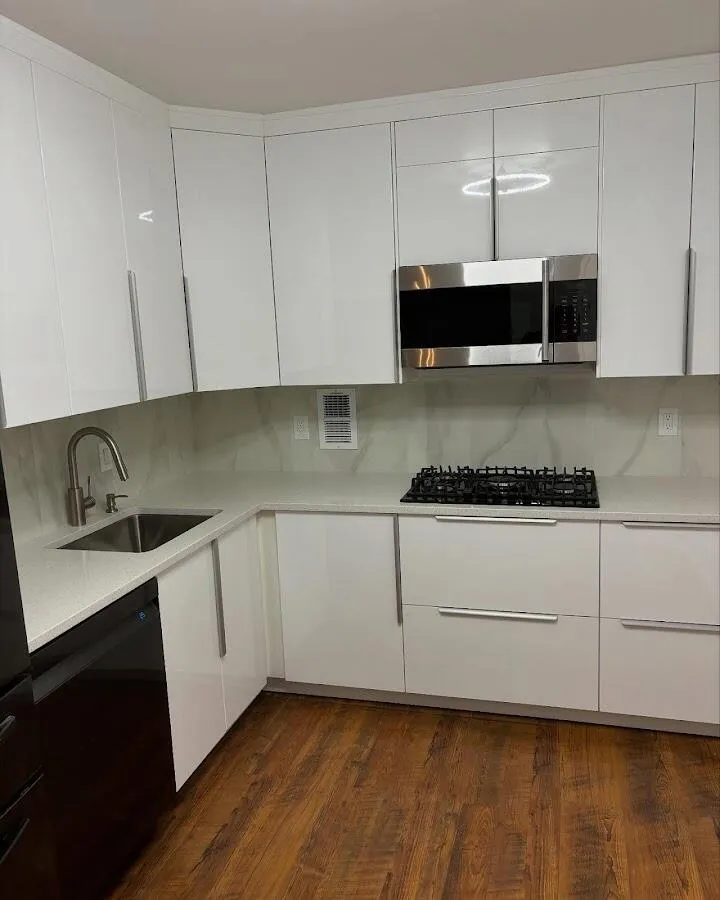 Restored kitchen with white cabinets after water damage in Aventura
